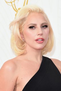 Lady Gaga on the red carpet with blech blond hair